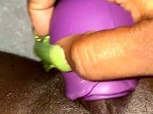 BW woman plays with a rose vibrator