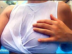 Flashy voyeur video of a MILF swimming in a hotel pool in her transparent shirt