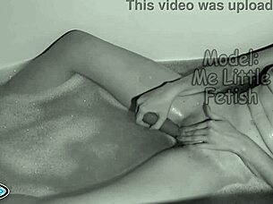 A skinny girl bathes in the evening to pleasure herself with a vibrator, climax