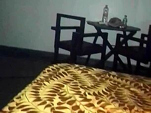 A hotel room where three people are makin loud noises