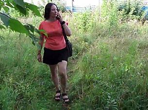 Big ass mature woman uses toy in park and urinates